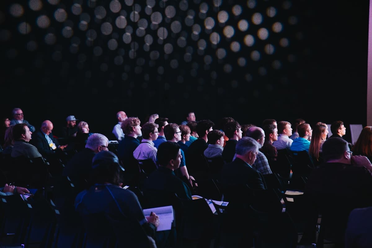 Audience seated for a keynote address at a corporate gathering